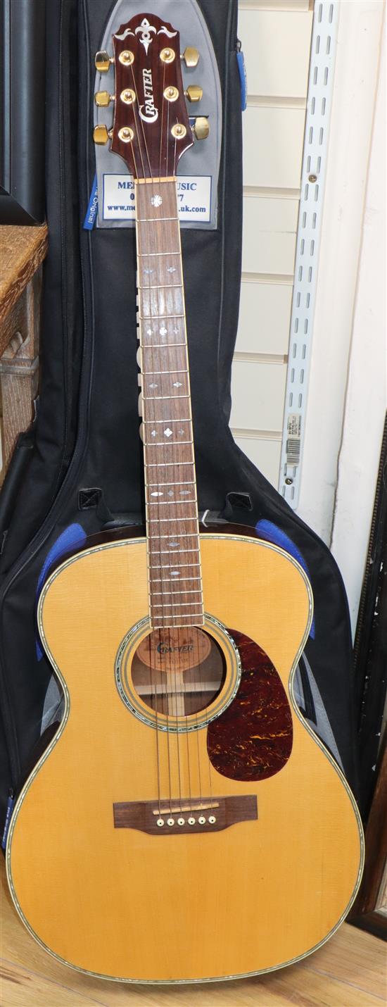 A crafter acoustic guitar with carry case